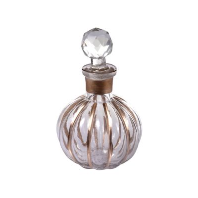 Portavela Vidrio Botella Dorada 11x11cm Concepts